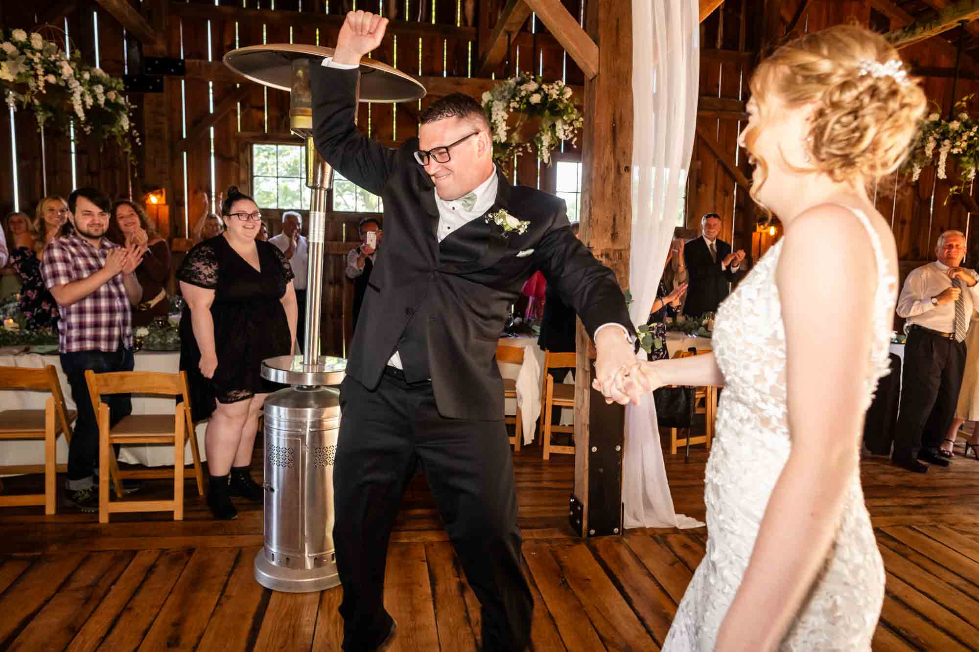 bride and groom dance as they are announced at their wedding reception at pinehall farms